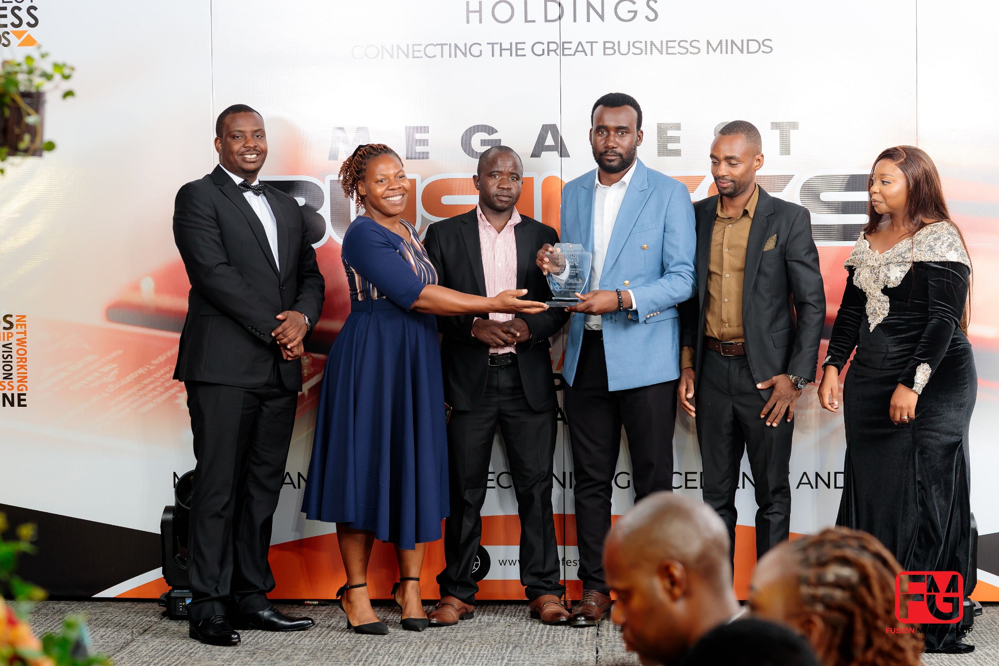 Rogel Security team with a crystal award